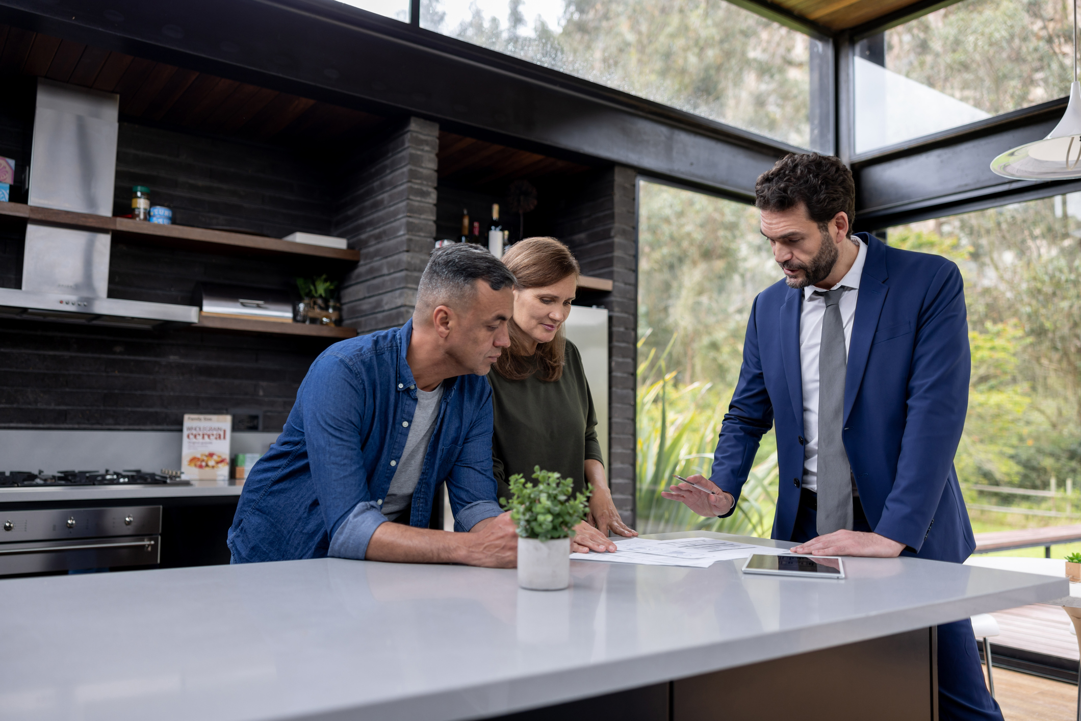 Financial advisor talking to a couple about their real estate investments